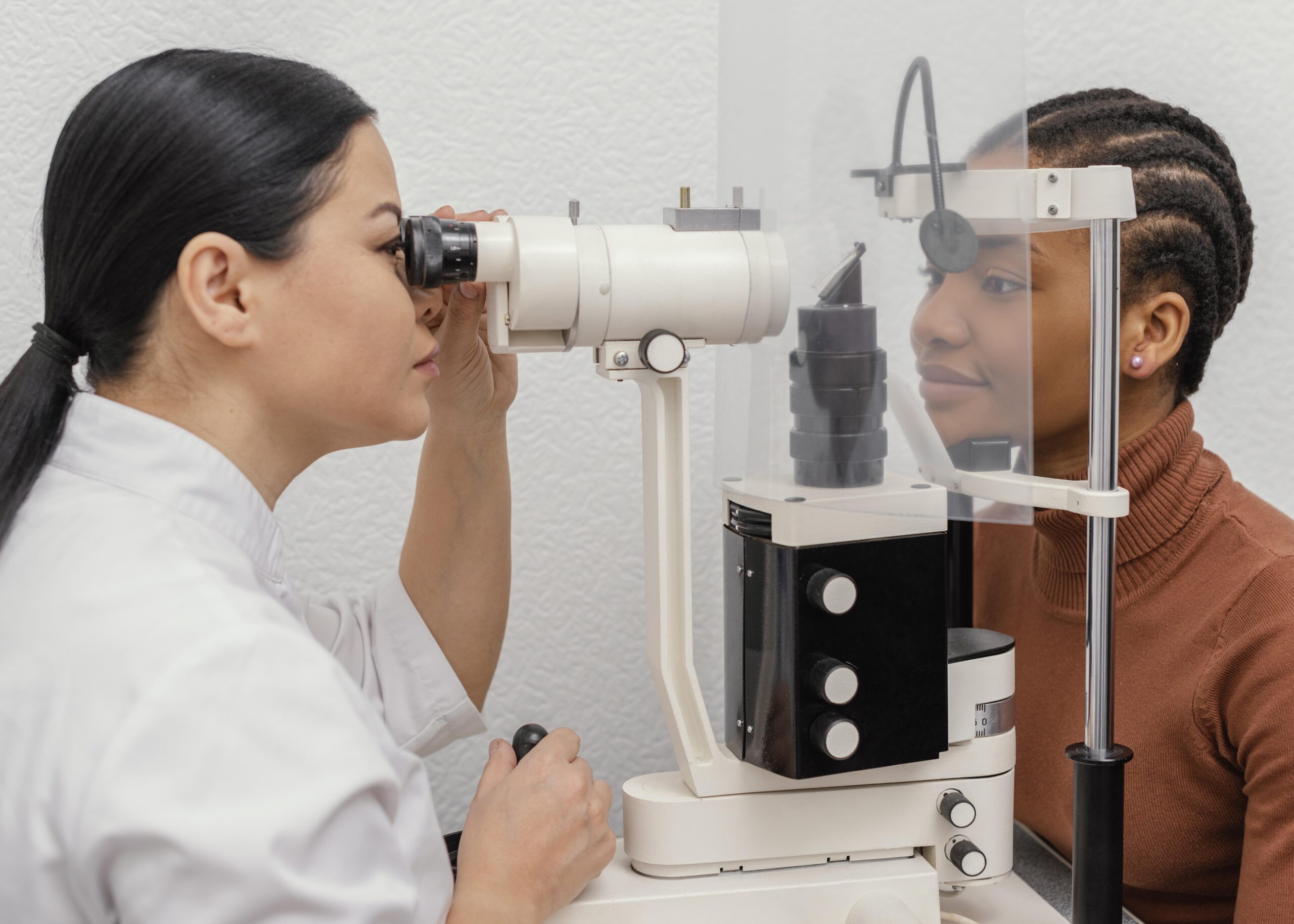 close-up-doctor-checking-woman-eyes