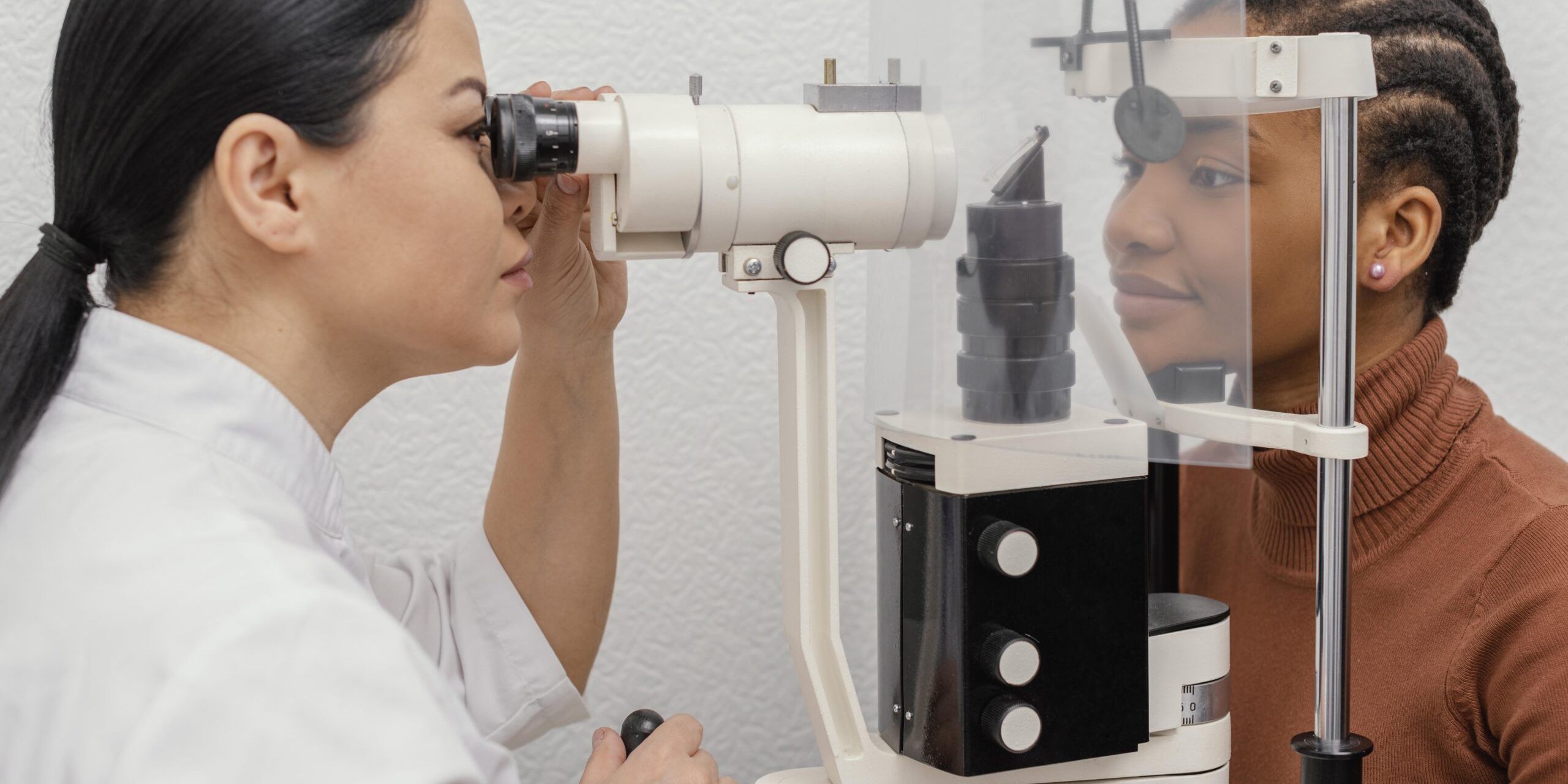 close-up-doctor-checking-woman-eyes
